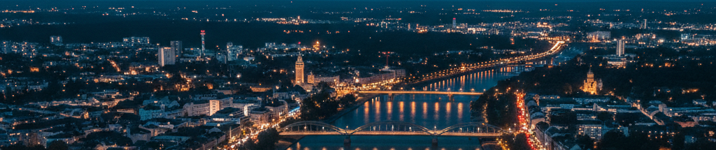 jorbis in Mannheim Mannheim aus der Vogelperspektive bei Nacht mit beleuchteten Brücken und Flüssen.